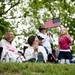 Brooke Barber, 4, waves a flag next to her family on Monday, May 27. Daniel Brenner I AnnArbor.com